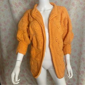 Vintage knitted / crocheted orange cardigan / jacket.